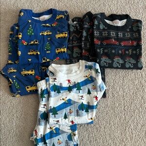 THREE pairs of Hanna Andersson Christmas pajamas. Size 6-7